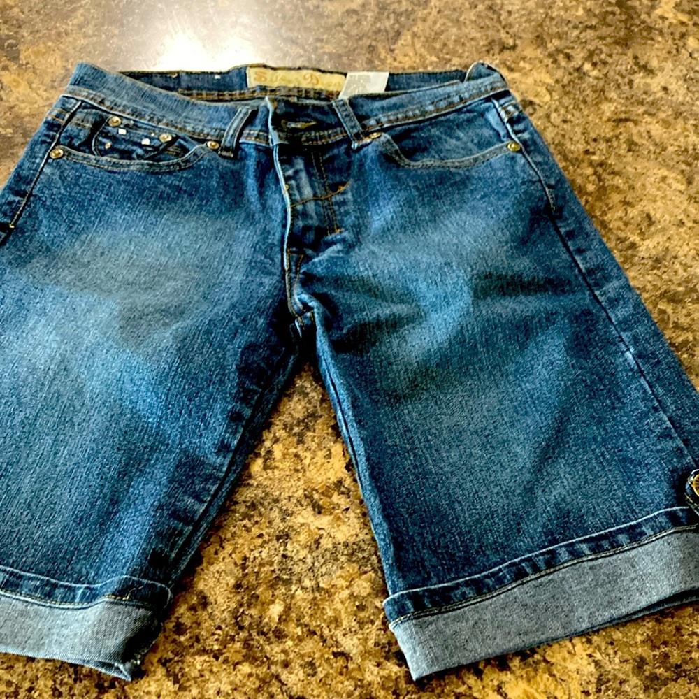 Silver diva denim shorts with silver accents on pockets